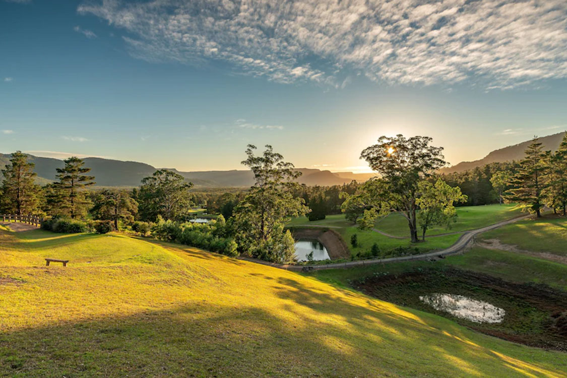 Sunrise over kangaroo valley with a lake