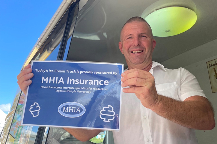 Mr Whippy driver holding up an MHIA sponsorship sign